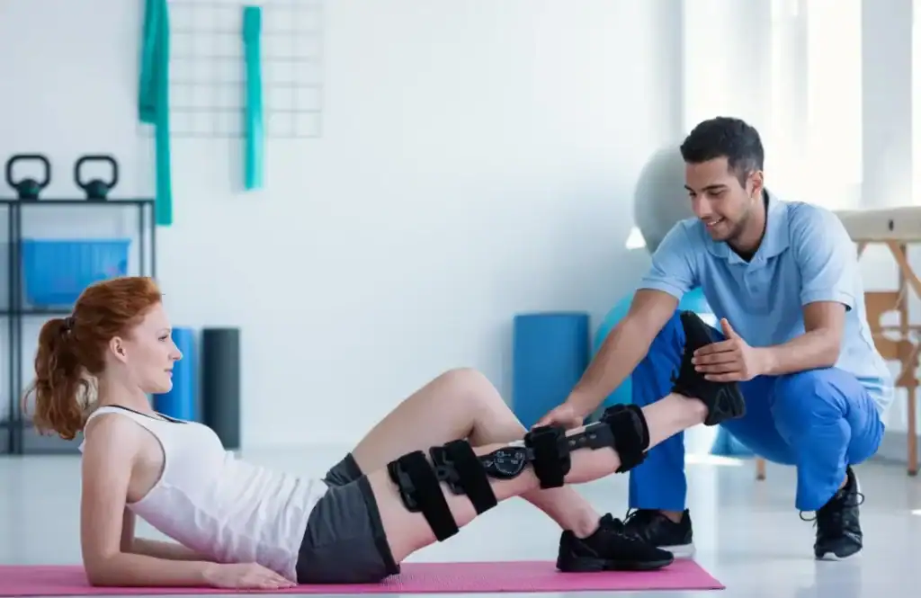 Woman having treatment to help muscle recovery Coalville after an injury